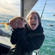 image of a girl holding a snapper